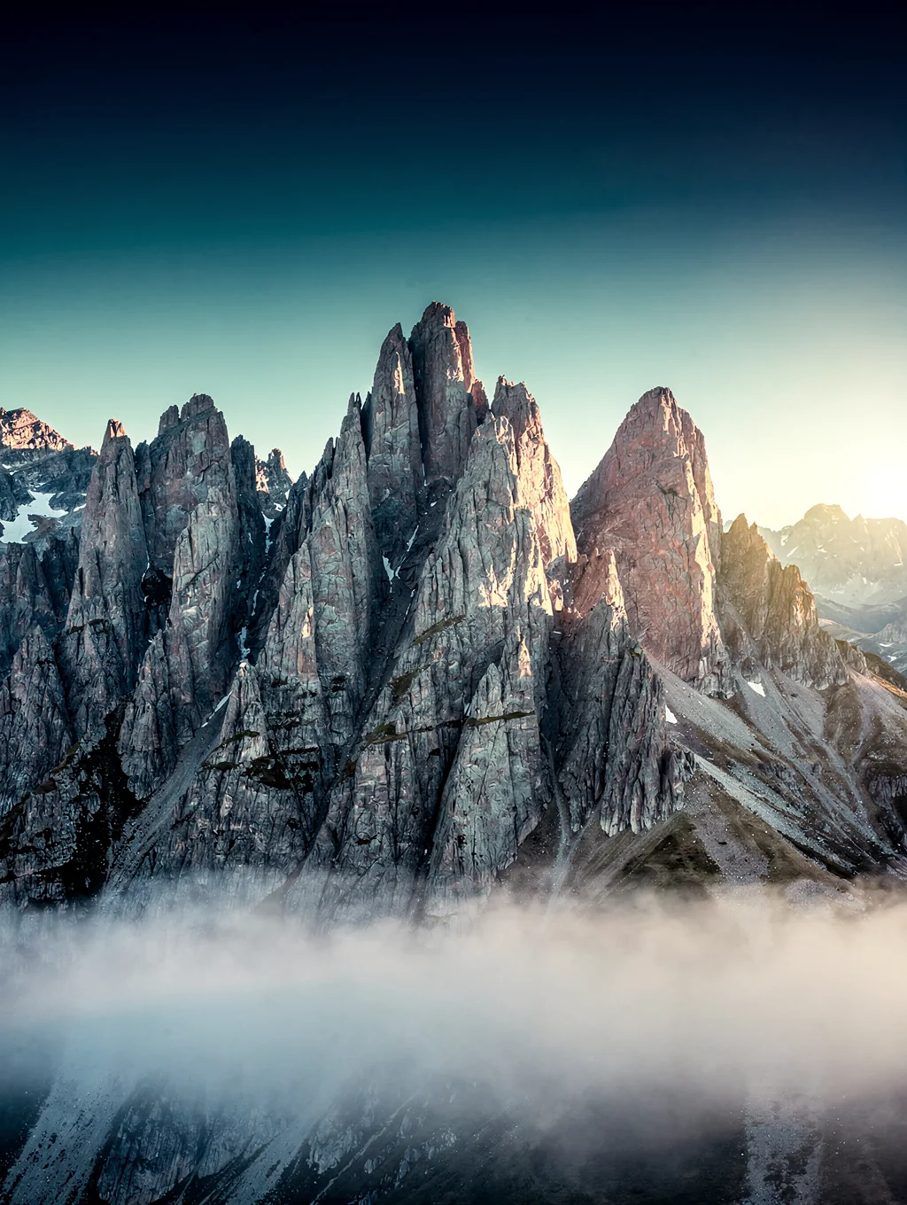 Jagged granite peaks glowing in soft morning light in Patagonia
